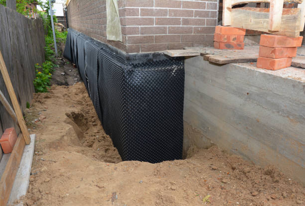 SJ Waterproofing Pros technician performing targeted Exterior Waterproofing assessment in Boyce, VA